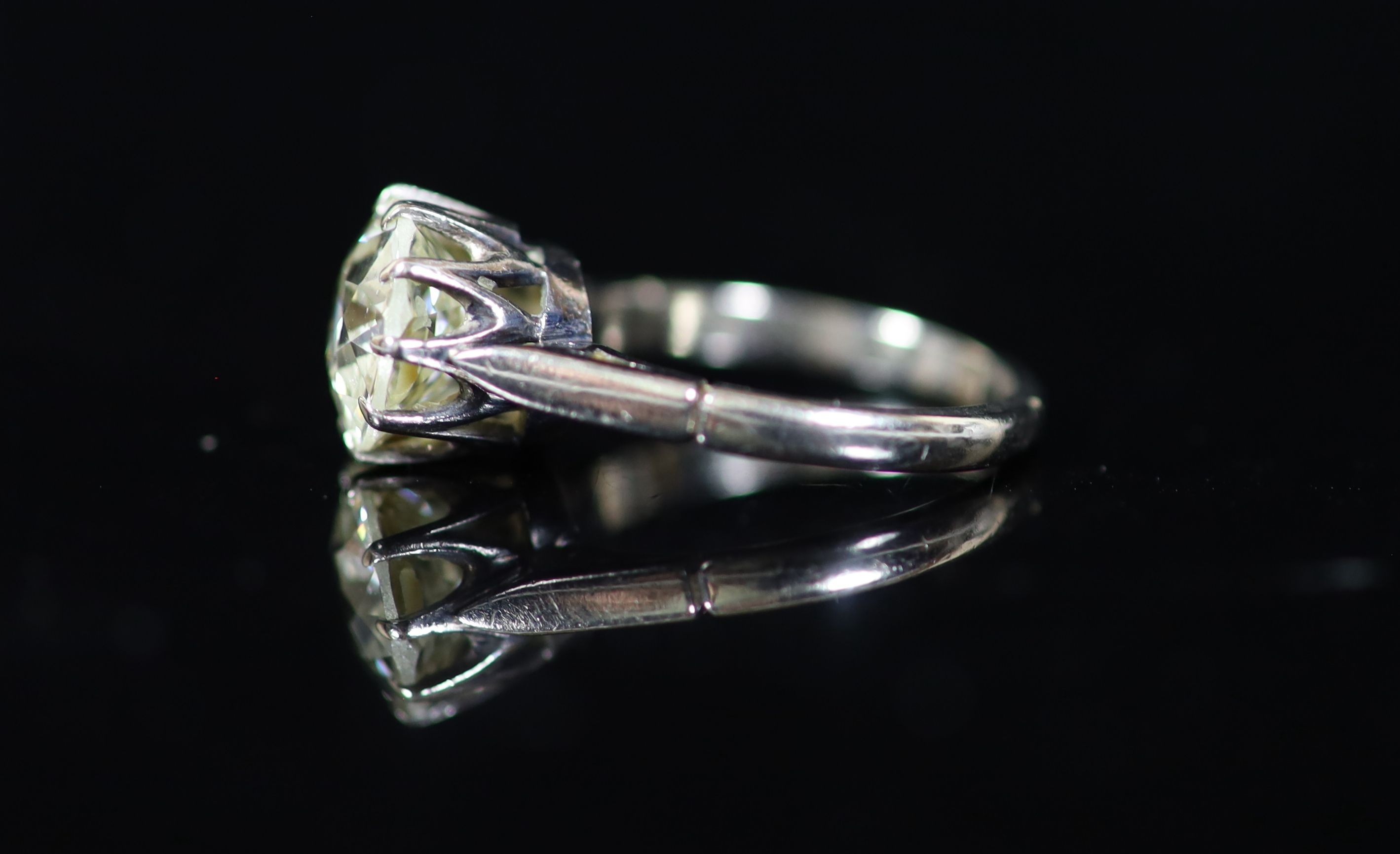 A platinum and solitaire diamond ring